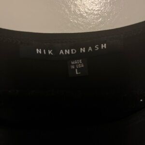 Nik and Nash Black Top Dress With White Bottom Trim..